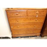 An early 20th century grained pine chest of drawers.