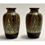 Gouda Pottery, a pair of painted and enamelled vases, circa late 1930's