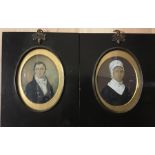 A pair of English school, early 19th century, portrait miniatures, one depicting a young gentleman