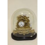 A late 19th Century gilt metal eight day mantle clock with a figure of boy in a hat complete with
