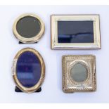 Four silver photograph frames, various dates