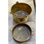 A large brass and iron 'jam' pan together with a twin handled copper pan 'Warwick' impressed mark (