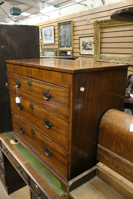 A 19th Century mahogany chest of drawers with three graduated drawers.