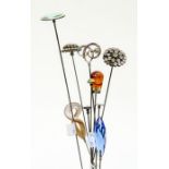 Hat pins- A collection of ten hatpins to include a silver Charles Horner scrolled top hatpin, a