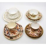 A collection of seven various 19th Century Crown Derby trios comprising cup, saucer and side