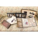 A collection of assorted 20th century postcard albums, together with a wooden draught set. (one