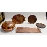 A Newlyn copper rectangular tray, stamped JP for John Pearson; and an Arts and Crafts oval tray; two