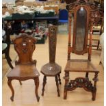 A Victorian oak hall chair, carved back, raised cabriole padded feet; another two similar (3)