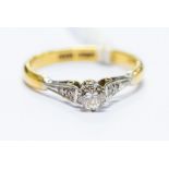 An 18ct yellow gold, platinum and diamond solitaire ring, round brilliant-cut diamond approx 0.30ct,