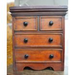 A Victorian miniature chest of drawers, two above two mahogany apprentice pieces