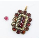 A Georgian garnet and seed pearl pendant, comprising a central cabochon lozenge shaped garnet with a