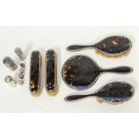 A George V silver and tortoiseshell dressing table brush set comprising, two hair brushes, two