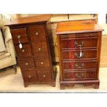 A 20th Century mahogany chest of drawers; a similar music cabinet (2)