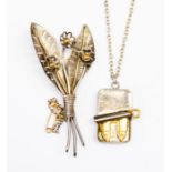 A sterling silver and 18ct gold floral spray brooch together with a pendant in the form of an opened