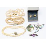 A graduated cultured pearl necklace with 9ct gold clasp, another and a simulated pearl necklace, two