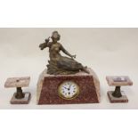***AWAY JMS ***A French rouge and beige marble clock garnitures with a figure of a seated lady on
