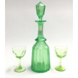 A uranium glass mallet decanter and two wine glasses Condition: Minor chips to foot of decanter,