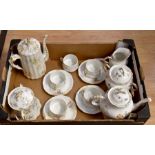 A Limoge part tea and coffee set comprising, teapot, coffee pot, sugar pot and cover, five cups