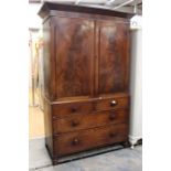 An 19th Century mahogany linen press, moulded cornice, two moulded panelled doors enclosing four