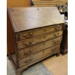 A George III mahogany bureau, circa 1800, fall front opening to drawers, pigeon holes and cupboards,
