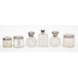Six various cut glass silver topped dressing table jars