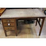 An early 20th century oak desk, three tier drawers on square supports.