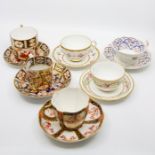 Eight tea cups and saucers, including coffee cans, Duesbury part Imari 5076, 8133, 6876, plus some