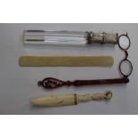 An ivory letter opener 19th Century, ivory page turner 19th Century, magnifier/ruler with white