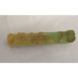 An archaistic jadeite handle, one side carved with a crawling dragon and bat, length approx. 85mm.