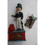 A cast money bank Uncle Sam together with a cast Oriental dipping bird (2)
