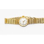 A ladies Everite 9ct wristwatch, with integral fancy link bracelet, round white dial with Roman