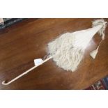 A cream silk parasol with silk tassels, almost certainly used by Queen Victoria, this item has a