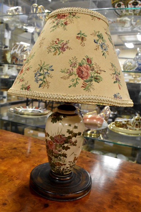 A Japanese Satsuma lamp base, with shade, painted florals with gilding detail, fitted on turned