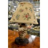 A Japanese Satsuma lamp base, with shade, painted florals with gilding detail, fitted on turned