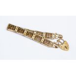 A 9ct yellow gold gate bracelet with fancy twist bars and padlock clasp, length approx. 17cm,