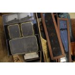 A collection of stereoscope slides and magic lantern slides within wooden box