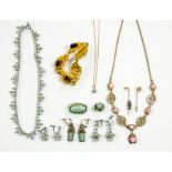 A collection of jewellery to include a 9ct gold chain with a cubic zirconia pendant, gilt metal