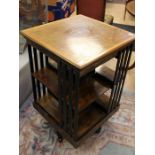 An Edwardian mahogany and line inlay revolving bookcase