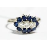 A sapphire and diamond 18ct white gold cluster ring, comprising three diamonds set in a row to the