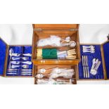 A large canteen of cutlery with lift-out trays, Dixons and others, early 20th Century mahogany