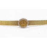 A ladies Omega 14k yellow gold and diamond bracelet dress watch, oval champagne dial with diamond