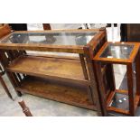 A modern mahogany open bookcase with a glazed inlay top, two other tier shelves; another similar