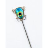 Newlyn- An Art Nouveau Newlyn enamel hat pin in the form of a peacock feather, silver scroll