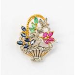 An 18k gold brooch in the form a floral arrangement formed as a basket set with marquise cut