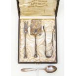 A boxed set of late 19th Century implements to include cake slice and fork and sugar tongs (