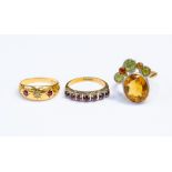 An 18ct gold cluster ring, comprising an oval citrine off set with alternate round cut peridot and