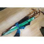 Walking sticks, golf umbrella, umbrella's and a whip (Q)