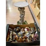 A collection of resin animal figures, including Meerkats
