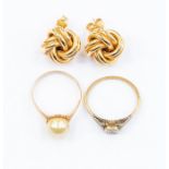 Two 9ct gold dress rings, one set with a single pearl ring size L1/2, the other set with a single