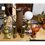 A selection of mostly French brass and copperwares including an original oil lamp and a pair of